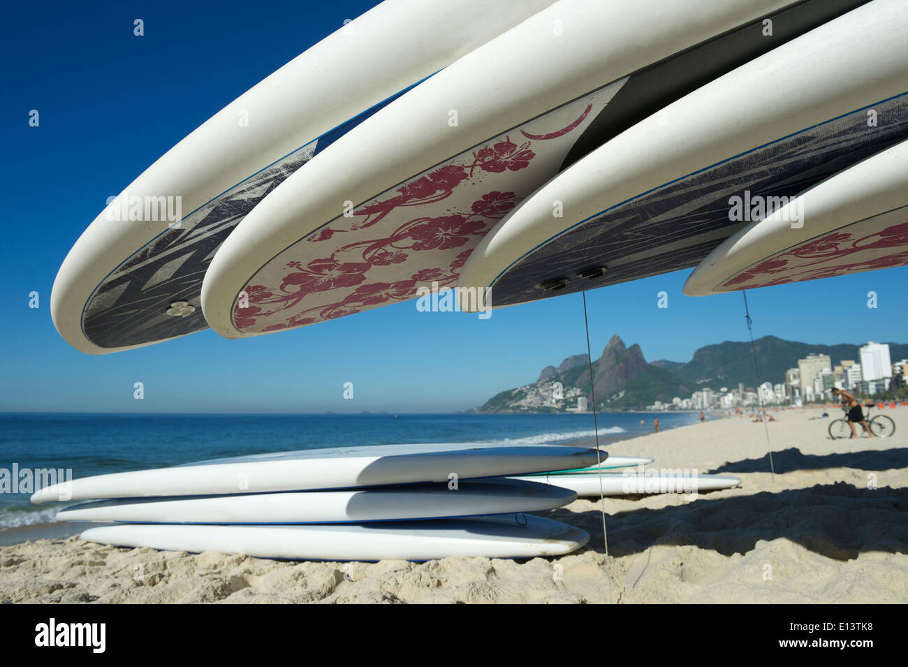 Stand up paddle long board surfboards stacked on Ipanema Beach Rio de Janeiro Stock Photo