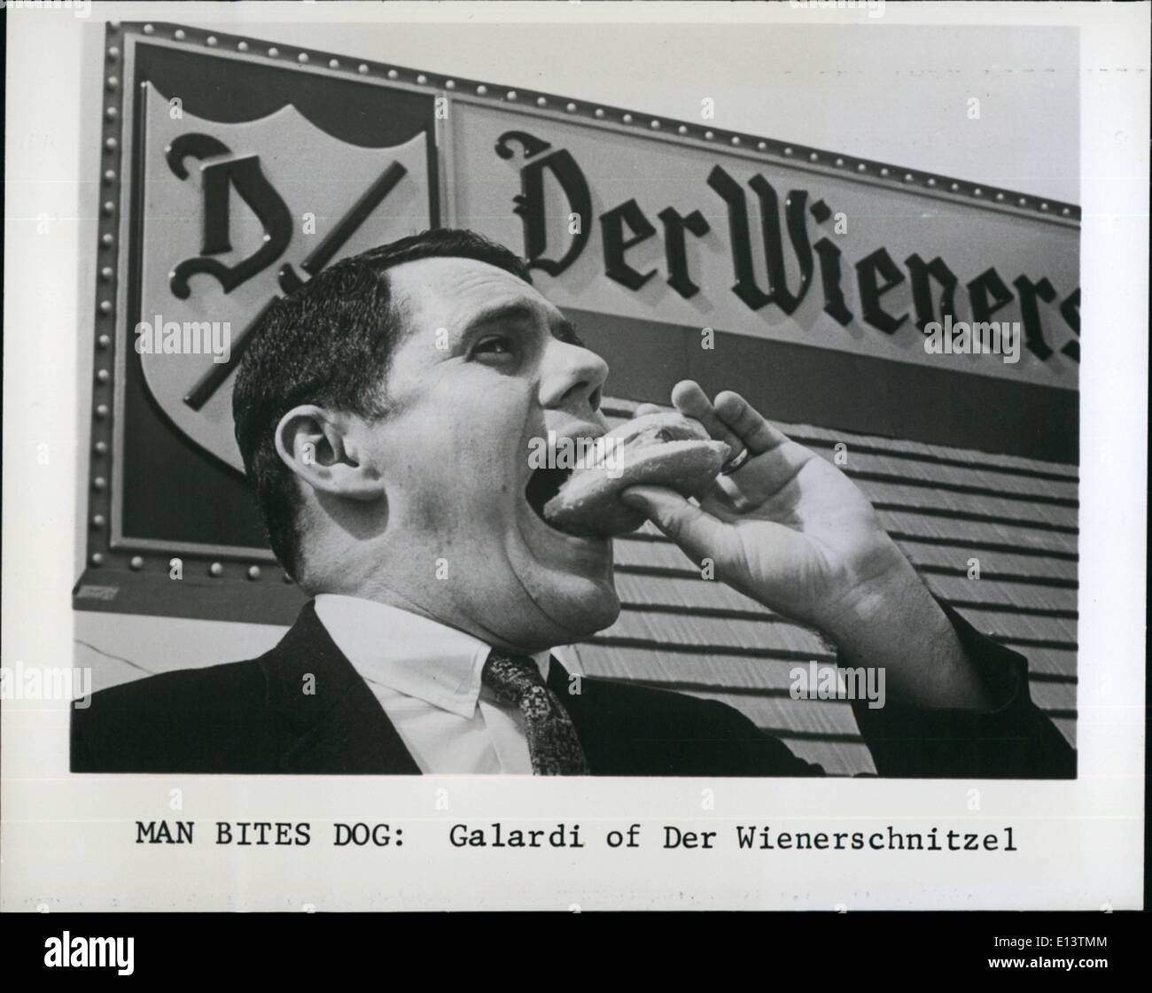 Mar. 27, 2012 - Man Bites Dog: Galardi of Der Wienerschnitzel. Stock Photo