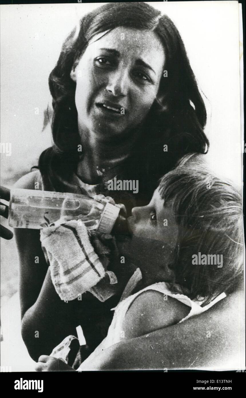 Mar. 27, 2012 - A dramatic snapshot from Nicosia. an 20 year-old mother,  Cnristodoulou from Yaloussa of Carpassia district, while crying she thanks the representatives of the Cypriot Red Cross, who gave her some fresh milk to her 15 month-old child, and who just arrived, being driven away from her house by turkish invaders. Credit: Greek Photo Agency Stock Photo