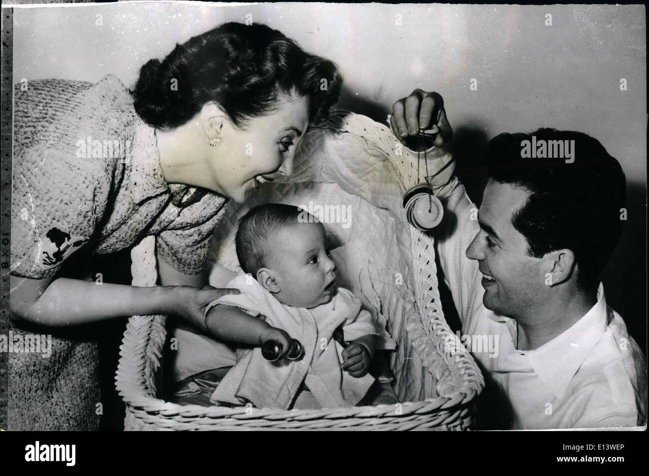 Mar. 27, 2012 - Garrett Is The Centre of Attraction.. The Parkes An Their Young Son. Garrett Christopher is only a baby - but he is the most important person in the world to screen star Larry Parkes and Betty Garrett (Mr. and Mrs. Parkes) his parents - seen here having a spot of fun together. Stock Photo