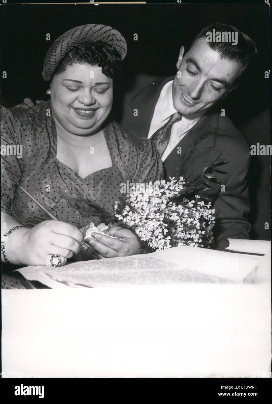 Mar. 27, 2012 - Heavyweight U.S. Star Marries a chorus boy in Paris.: June Richmond who weighs 220 lbs was married today to chorus boy Guy Province at the Town Hall at Neuilly a suburb of Paris today. They are both appearing in the Casino de Paris revue ''Thunder Revue'' (Revue de Tonnerre) Photo show The newly weds sign the register at the Neuilly Town Hall after their wedding today. Stock Photo