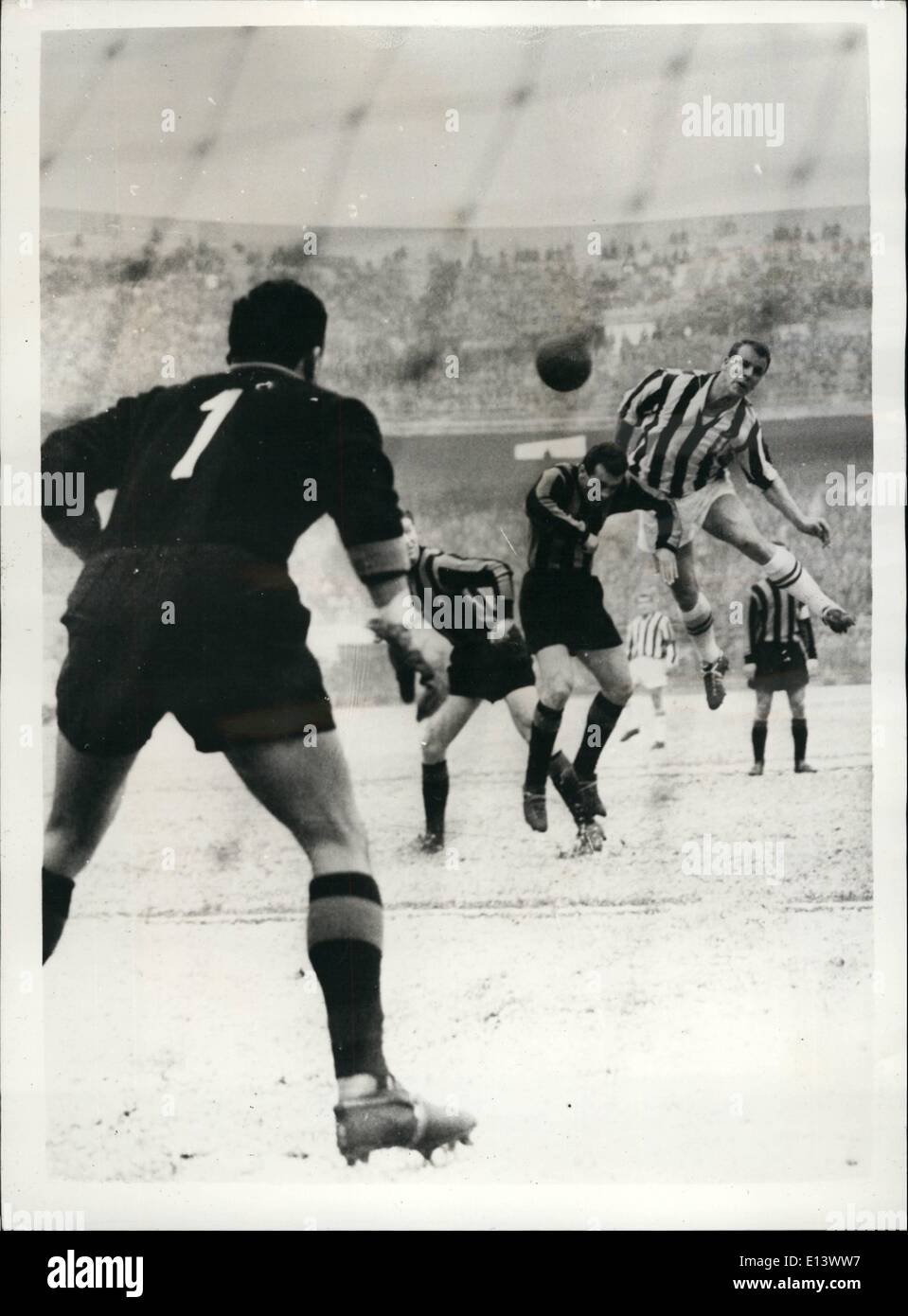Mar. 27, 2012 - John Charles Scores Vital Goal - ''Juventus'' Beats International Milan. A huge crowd attended the log awaited match between 'Juventus' Turin and ''Internationale'' Milan - in Milan. The match ended in a win for ''Juventus' - the first goal of the match being scored by John Charles. Photo shows: The incident as Cardarelli and Fongaro of the ''Inter'' team tackle John Charles - but cannot stop him from scoring the first goal. A split second later the ball entered the net Stock Photo