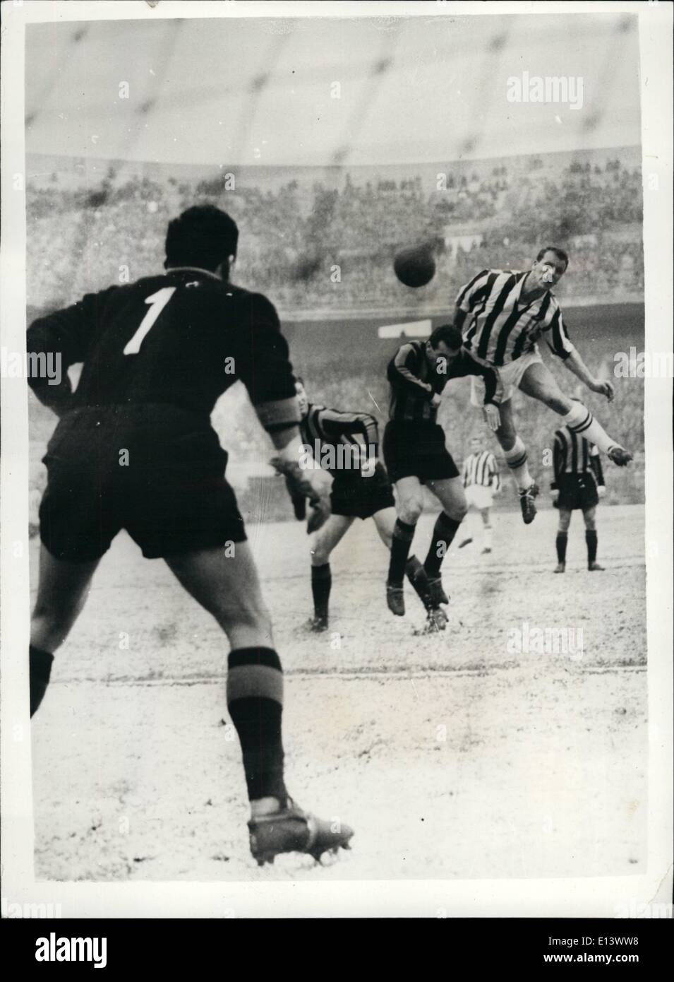 Mar. 27, 2012 - John Charles Scores Vital Goal - ''Juventus'' Beats International Milan. A huge crowd attended the log awaited match between 'Juventus' Turin and ''Internationale'' Milan - in Milan. The match ended in a win for ''Juventus' - the first goal of the match being scored by John Charles. Photo shows: The incident as Cardarelli and Fongaro of the ''Inter'' team tackle John Charles - but cannot stop him from scoring the first goal. A split second later the ball entered the net. Stock Photo