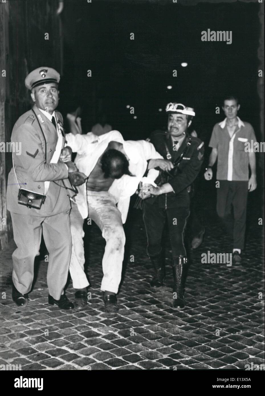 Mar. 27, 2012 - War in Vietnam, war in Middle Orient and war in Rome, but to cause of the hot. A Venezuelan painter Carlos Aponte, 28, living in Rome, this morning at the dawn was stopped by the Police because he was taking a bath in the Trevi Fountain. On the contrary to show his identification card he beat the policemen. The result The painter was sent to the prison. Stock Photo