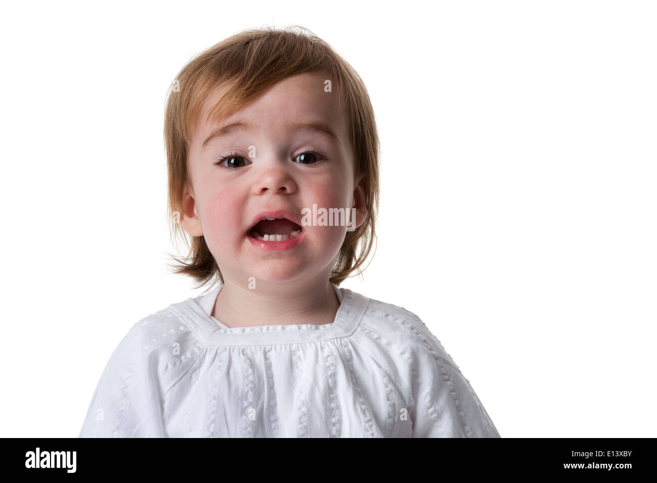 Portrait of a surprised little girl on white background Stock Photo - Alamy