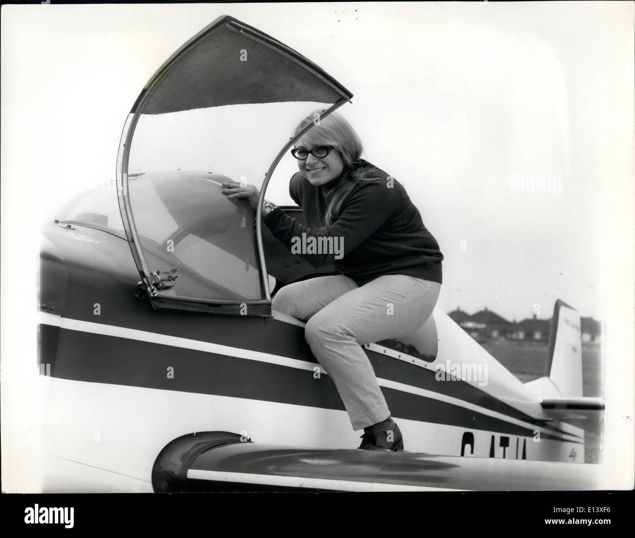 Mar. 27, 2012 - Rosalind climbs into the cockpit for a spin at Rochester Airport.A confident smile for the photographer before she takes off. Stock Photo
