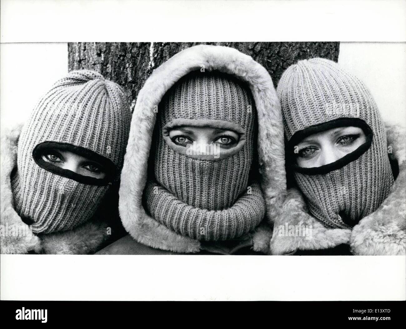 Mar. 27, 2012 - Hot, Hotter, Hottest! Demonstrating against the heat, which presently rules over Europe, are seen these three young ladies doing in an extraordinary way: with these very warm mask-like caps. Of course this knitting fashion is made for winter days, coming from Sweden, but who knows, summer might get frightened at this view, turning cold a little bit. Stock Photo