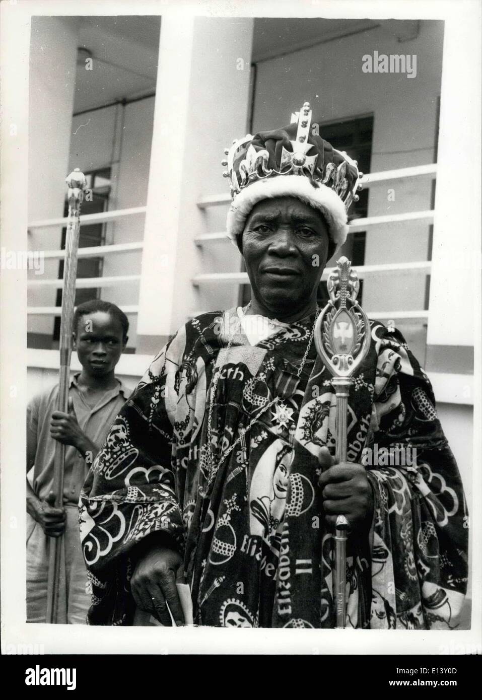 Mar. 31, 2012 - ....And Obi Oksi II Dressed His Best For The Duke: The Gloucester's Nigerian Tour did not go unmarked in the special diary of Obi Oksi II, Natural Ruler of Onitsha, When the Duke and Duchess were recently visiting Enugu in the Eastern Region. For the ceremony in the Assembly House his majesty wore his ermine-lined crown, carried his staff and symbols and wore his gold signet ring, not forgetting to pin a treasured Imperial Honour graciously presented him by Her Majesty Queen Elizabeth II of Great Britain and the Commonwealth Stock Photo