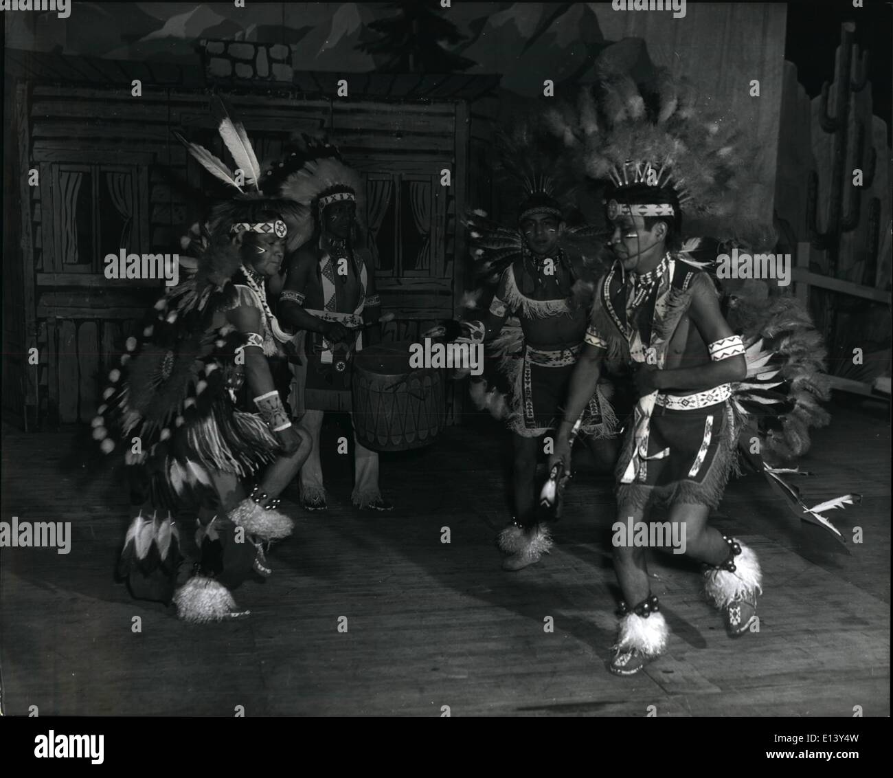 Mar. 27, 2012 - ''Honest 'Injun''' - They're real Red Indians: The cowboys traditional enemy was the Red Indian. Today the native Indian of the Americas is a protected citizens living on his own reservations. not often leaving his home State. But internationally - famed cowboy Gene Autrey has persuaded some genuine Jemez Indians from the Land of Enchantment, as New Mexico is known, to join his touring Western Show, now at London's empress Hall Stock Photo