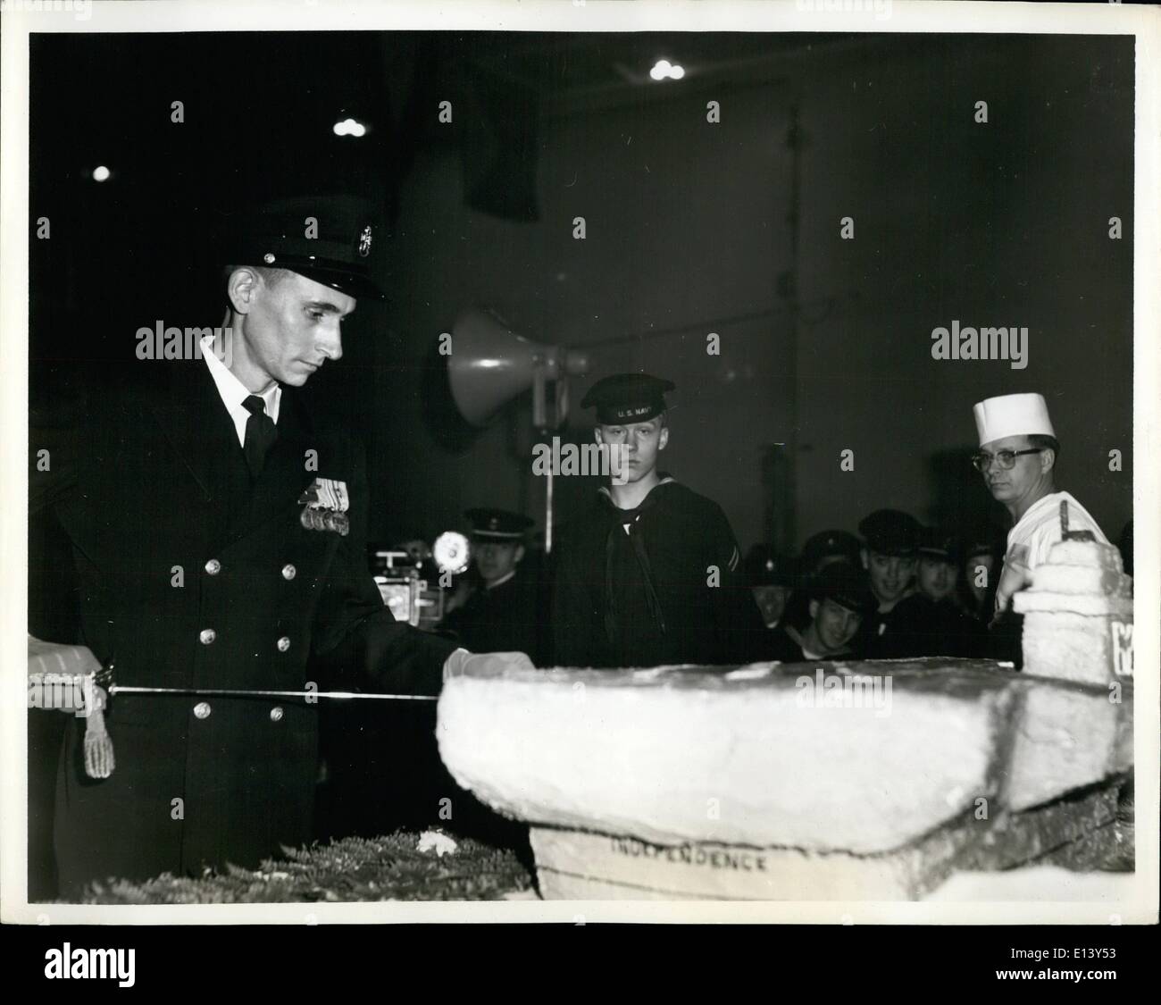 Mar. 27, 2012 - USS Independence CVA 62: Taking the first slice of the extra large cake, a replica of Independence, is J.R. Neary , chief machinist's mate. Stock Photo