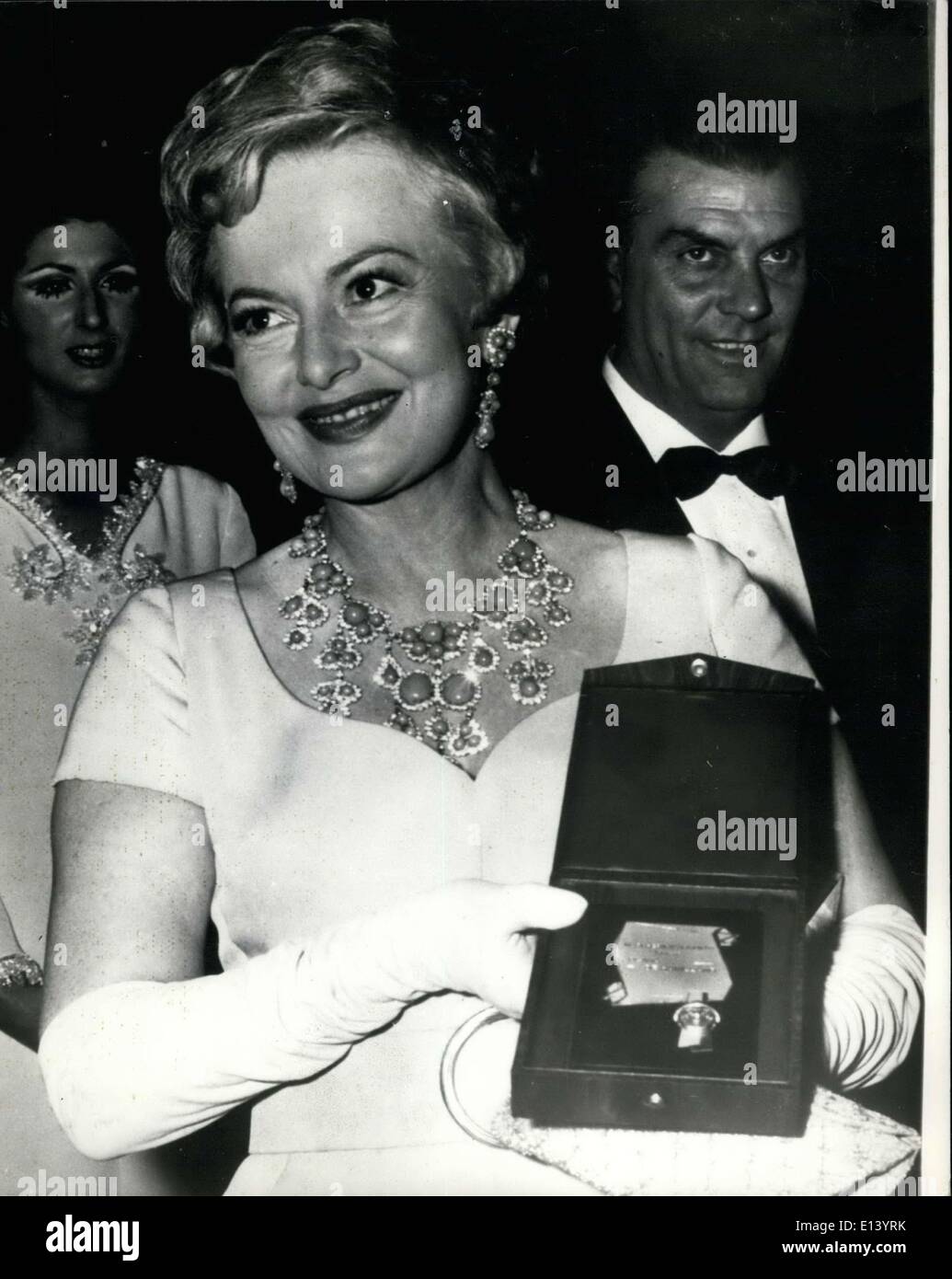 Mar. 31, 2012 - The Annual ''Silver Mask'' Awards in Rome : Stars and personalities from all over the world gathered at Rome's Sistina Theatre for the annual presentation of the ''Silver Mask'' awards. Photo shows American Actress Olivia De Havilland, who is in Rome to film ''The Adventure''s '' with her ''Silver Mask'' award after the presentation. Stock Photo