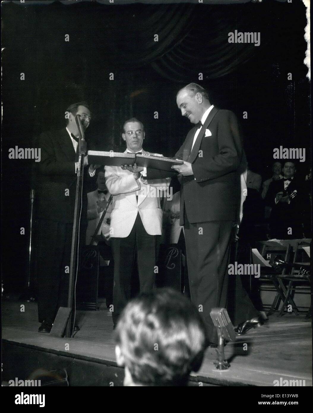Mar. 31, 2012 - Ted Heath's Oldest Instrumentalist presents Mii with a Silver Salver: Jimmy Coombes, who has been with the band Stock Photo