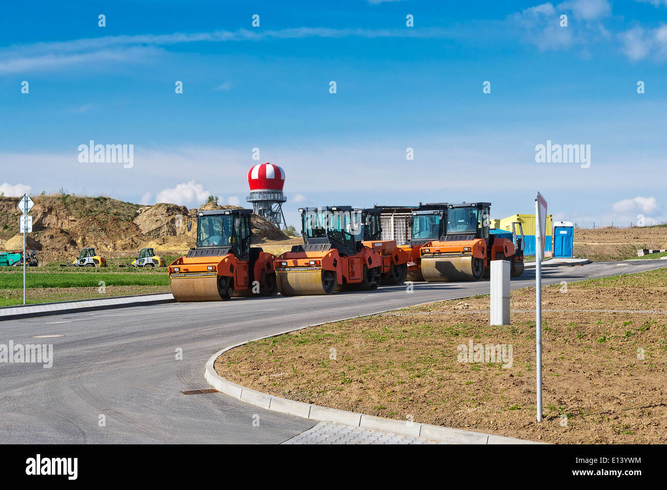 Road construction site with steam rollers and other construction equipment. Stock Photo