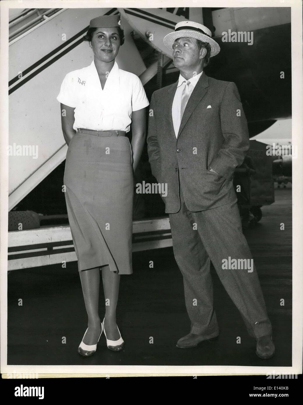 Mar. 31, 2012 - George Jessel, World Famed toastmaster, gives TWA hostess Dolores Gregory the once over following their arrival Stock Photo