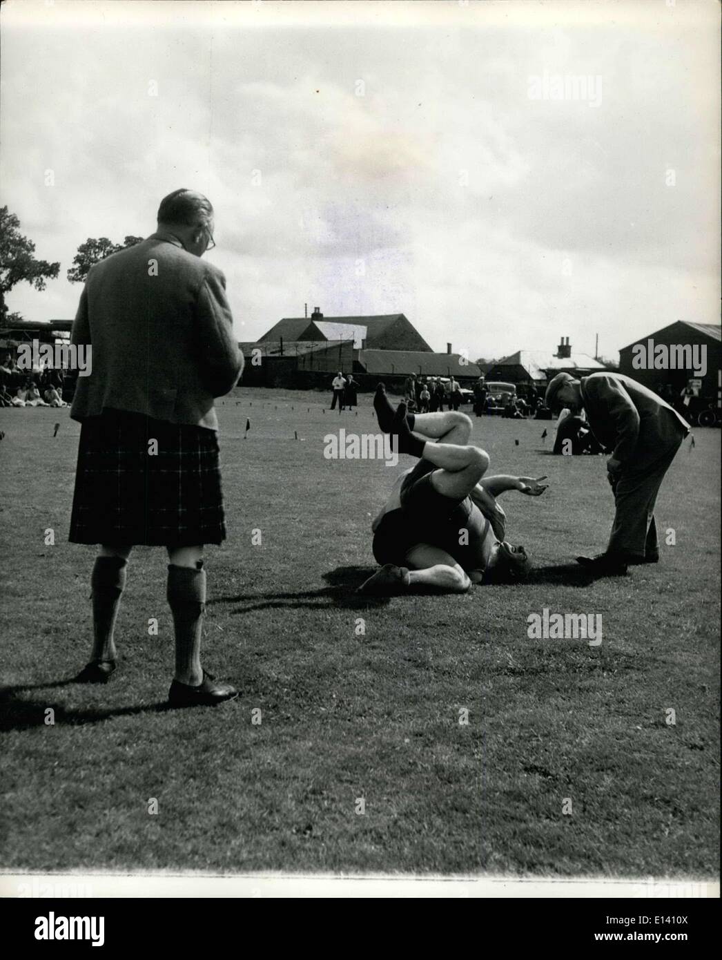 Mar. 31, 2012 - Crieff Highland gathering at Market Park, Crieff.; The catch-as-catch-can wrestling event, being judged by Dr. H. Graham of Perth, who has to get down low to see what is going on. Stock Photo