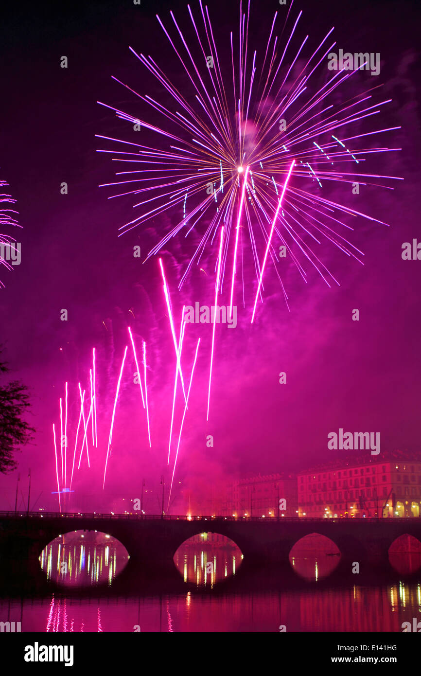 Fireworks over the Vittorio Emanuele I bridge during the Saint John night fireworks show in Turin. Stock Photo