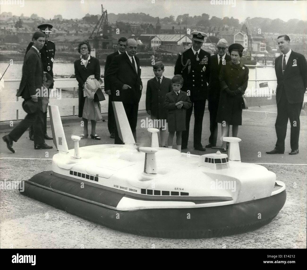 Mar. 31, 2012 - Royal Children See Hovercraft Model: H.M. The Queen arrived at Cowes, Isle of Wight yesterday, to visit the British Hovercraft Corporation's Western Terminal at East Cowes and inspect craft being built there. The Queen was accompanied by Prince Charles, Prince Andrew and Viscount Linley, Princess Margaret's son. Photo shows H.M. The Queen and her party inspect a model of the British Hovercraft Corporation's SRN 4 - during their visit yesterday. Next to the Queen in Uniform is Admiral of the Fleet Earl Mountbatten of Burma, Governor of the Isle of Wight Stock Photo