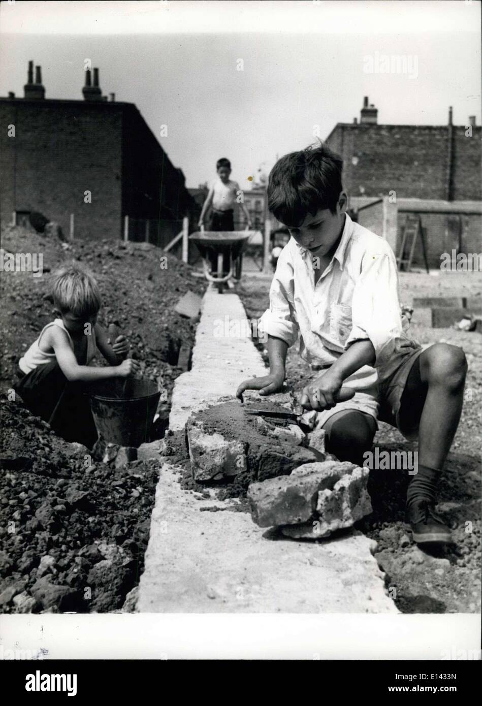 Apr. 04, 2012 - Building the new ''Lambeth Walk'' in Lollard playground. In foreground is Brain Gardner laying the bricks while Stock Photo