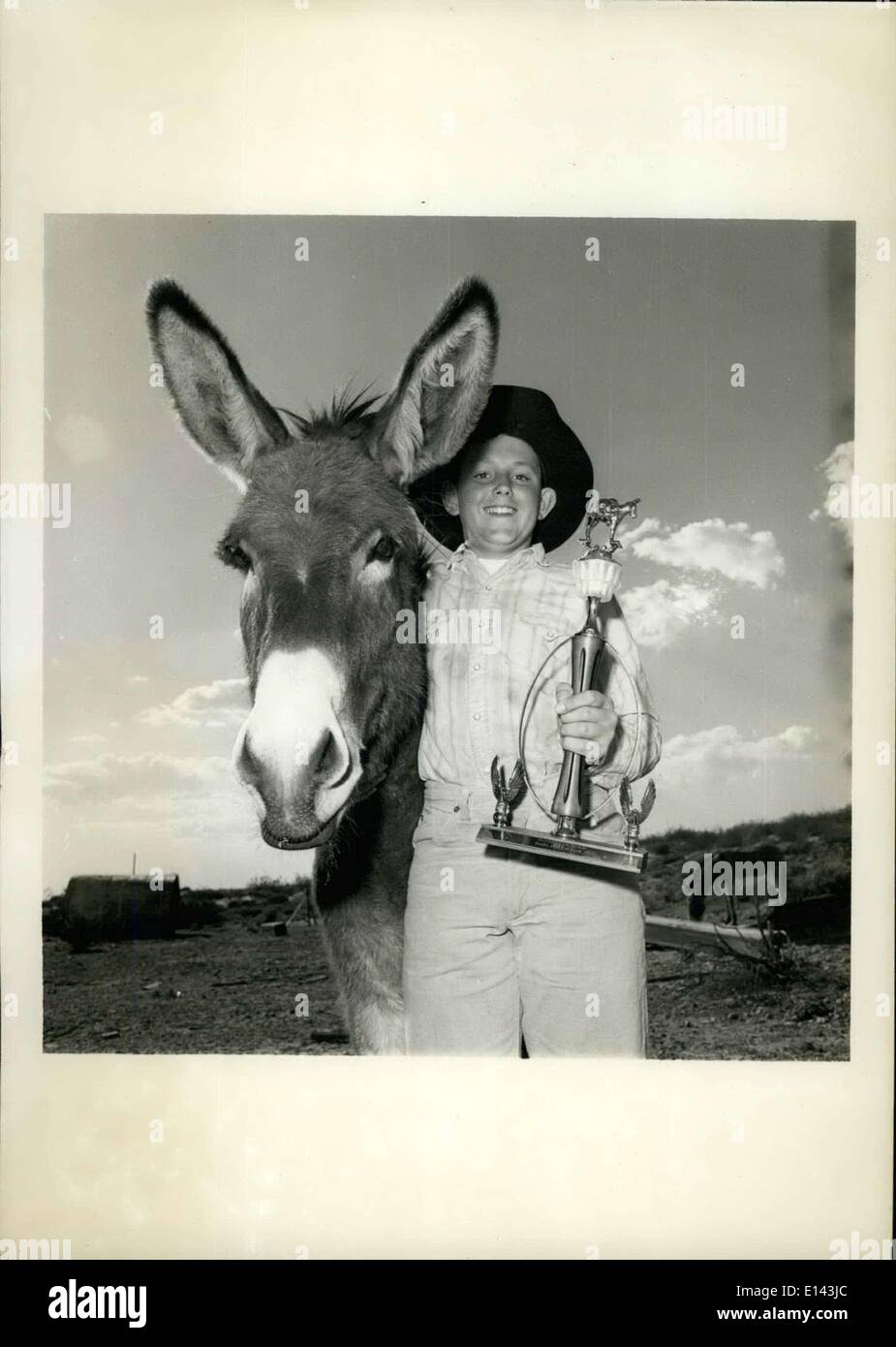 Apr. 04, 2012 - Al Pauley, 13-year-old World's Junior Champion, also won Burro Claim Stake Race and is shown here with animal he rode, Tropico Tom. Stock Photo