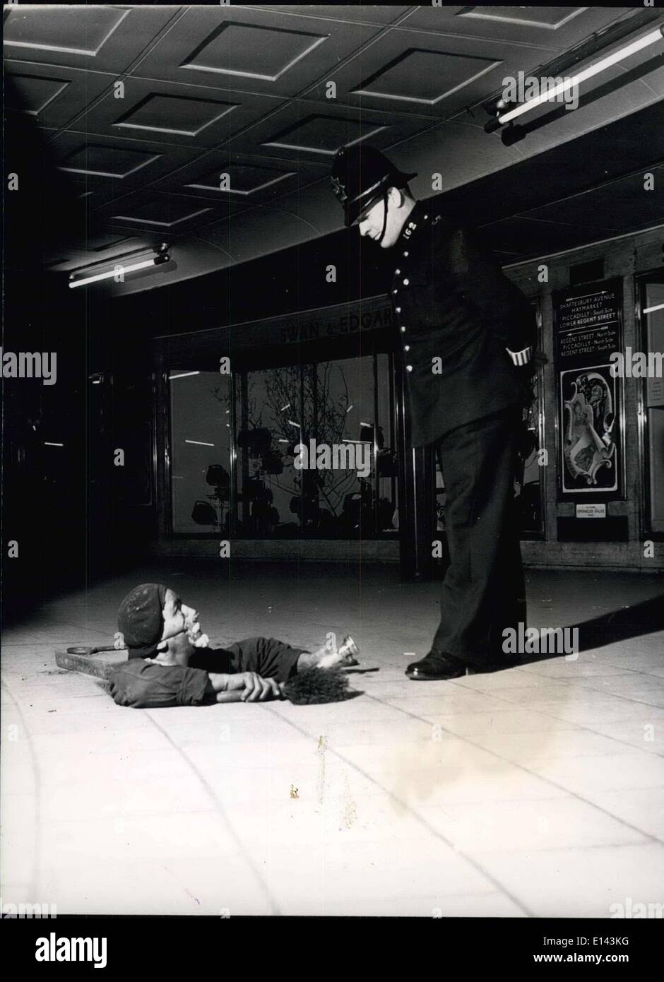 Apr. 04, 2012 - The Demon King of the Underground . This policeman on night duty at 12.15 a.m. at Piccadilly Circus Underground station had quite a shock when Leonard ( Darky ) Fiedl popped up through a trap door just like the Demon King in the pantomime. He was coming up for a breather after working in the dust and darkness below. Stock Photo