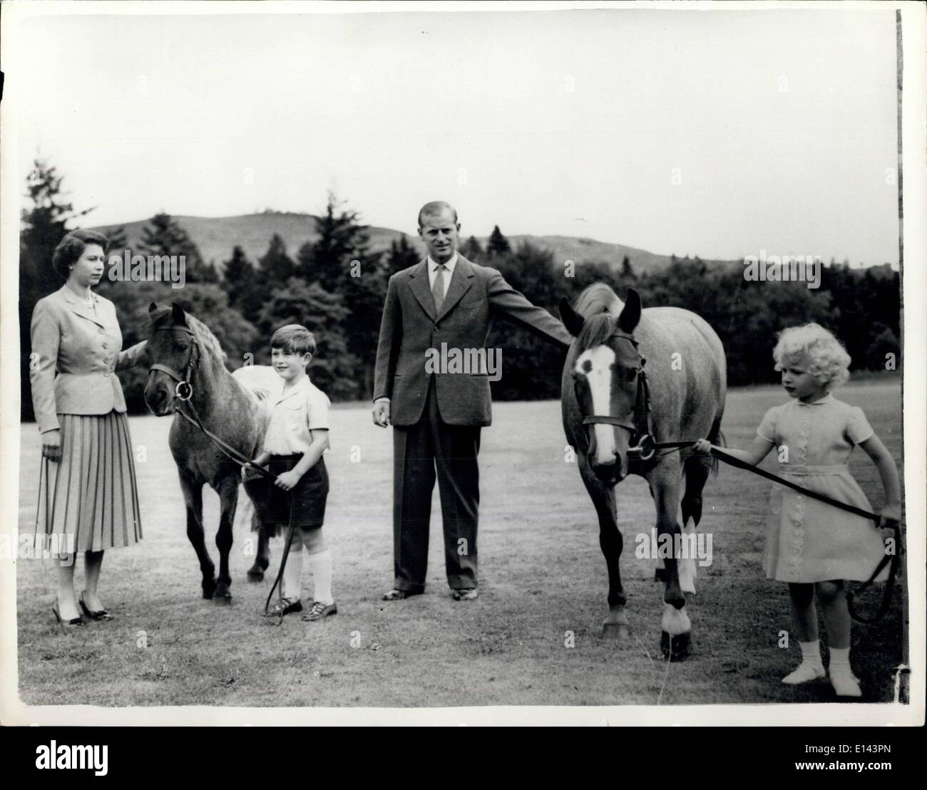 Apr. 04, 2012 - Royal Family At Balmoral..Exercising the Ponies: Queen Elizabeth - Duke of Edinburgh and their Children Prince Charles and Princess Anne exercise their ponies in the grounds of Balmoral Castle during the August holiday this year. Prince Charles holds ''Williams''; Princess Anne holds ''Greensleeves''..Balmoral is an 11,000 acre estate bought by Prince Albert in 1852 for 31,500- the castle being built three years later - and is the private property of the Sovereign. Stock Photo