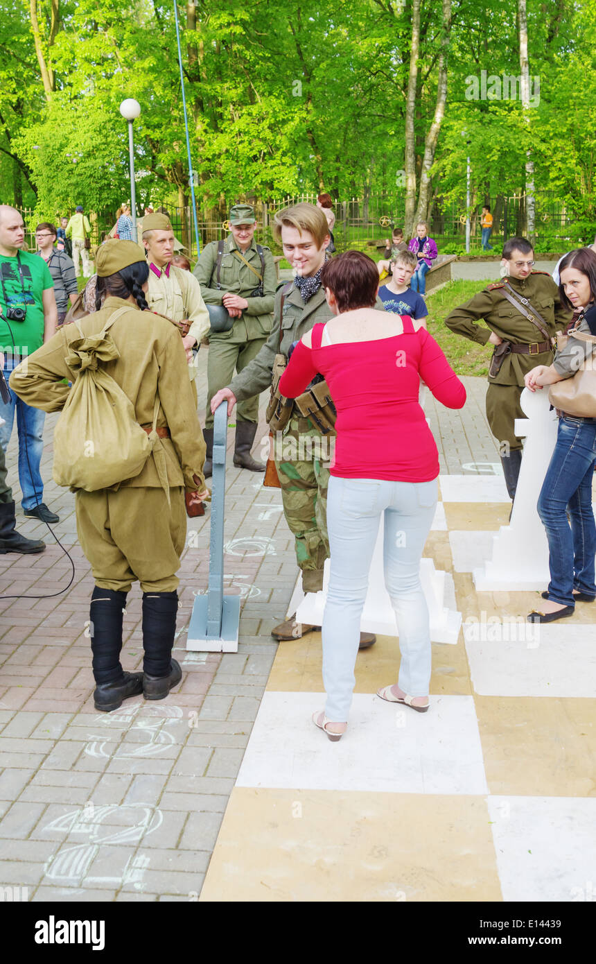 The Live Chess tournament on the imitating a chessboard, where actors from museum military club and guests acted with figures. Stock Photo