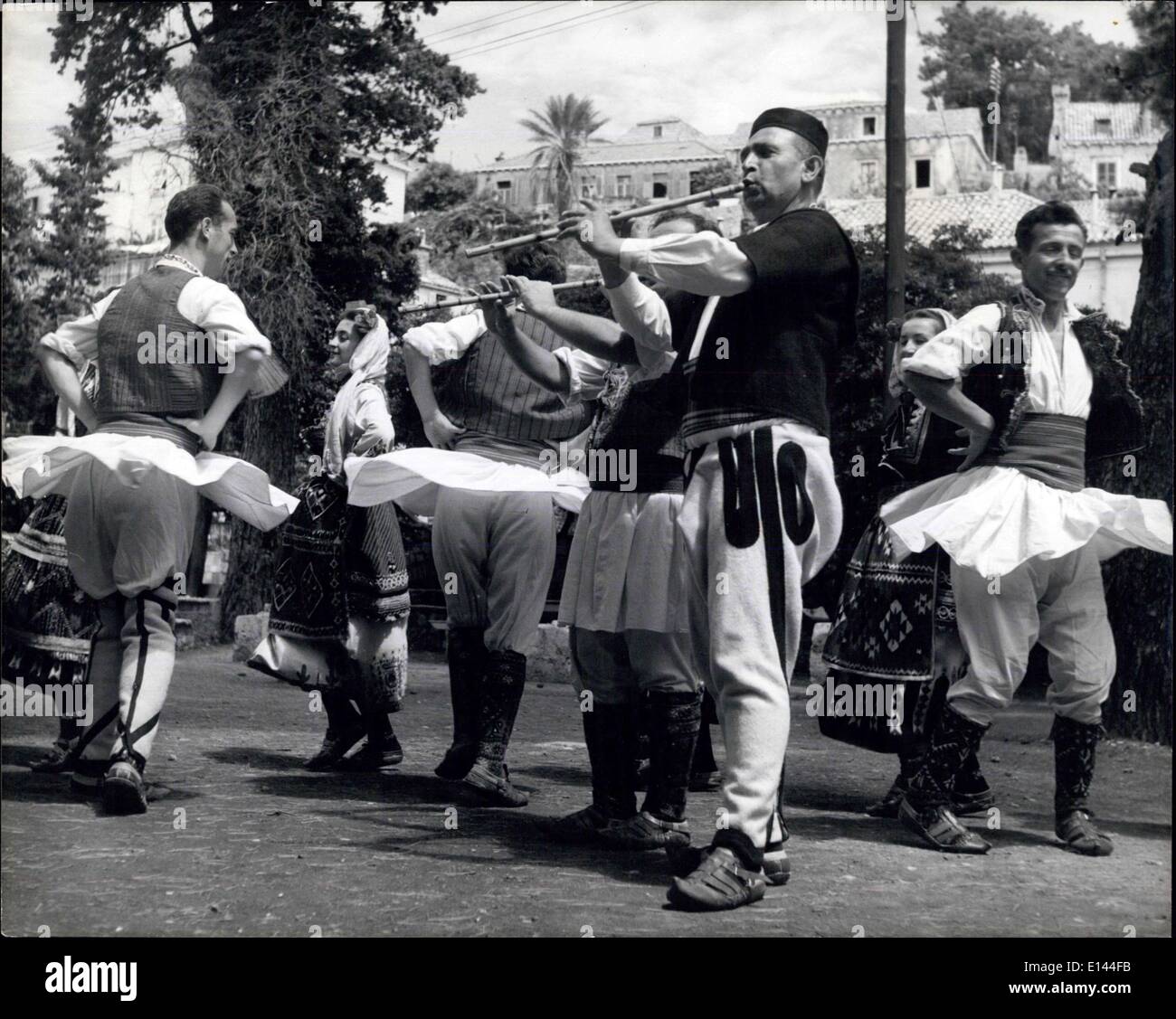Apr. 04, 2012 - The dancers of Yugo-Slavia.: A Macedonian celebration dance. The men whirl round and their little skirts flare out. Music is provided by the flutes. Stock Photo