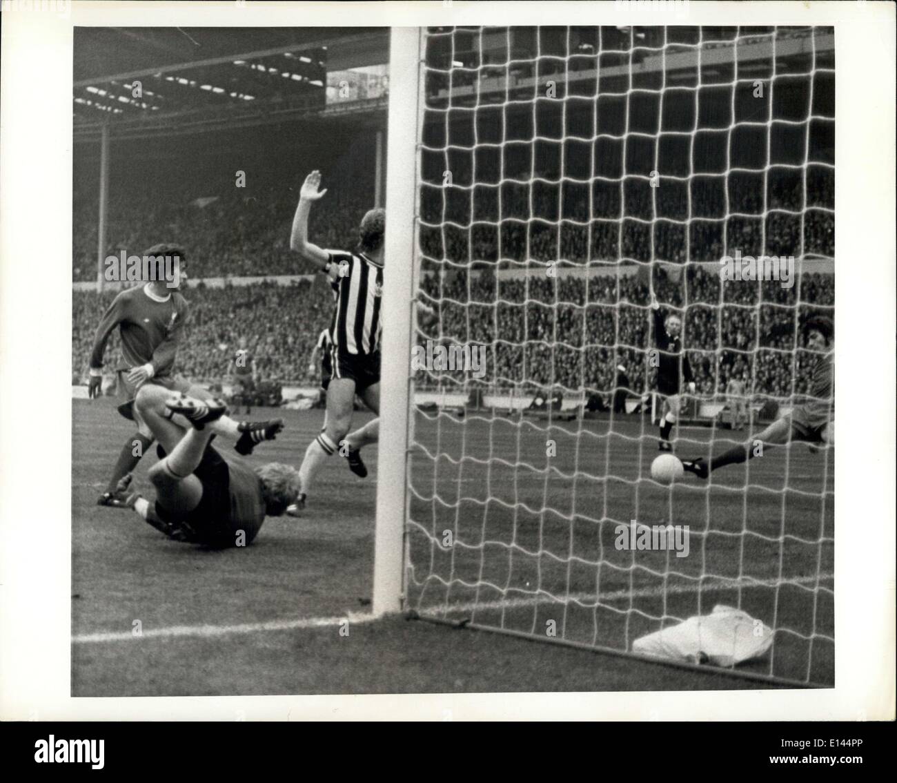 Apr. 04, 2012 - Liverpool's Third Goal: Kevin Keegan (right) about to shoot ball into Newcastle net, with the goalkeeper, Iam McFaul, already on ground after parring an earlier shot. Liverpool defeated Newcastle by three goals to nil and so won the British F.A. Cup Final at Wembley Stadium, London, today, May 4th. Stock Photo