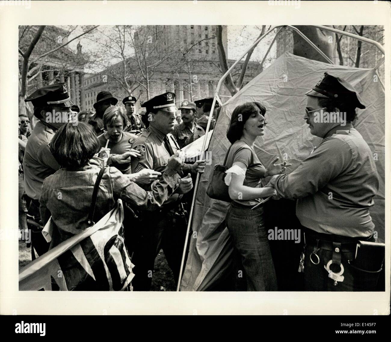 Apr. 04, 2012 - Cops and protesters battle in Foley Sq. By Brett Alexander and Stephen Gayle: Police and demonstrators exchanged blows with nightsticks and fists today during a protest in Foley Square over cutbacks in federal unemployment benefits. The melee broke out at about 2 p.m. when police started pulling down tents the demonstrators had erected in a park across from the Federal Courthouse. Stock Photo