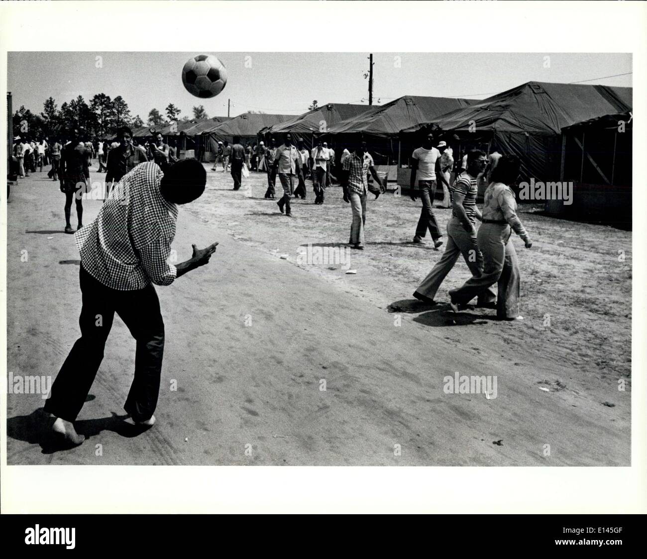 Apr. 04, 2012 - Cuban Refugee pass the time by playing soccer in the tent city at Fort Waton Beach fairgrounds/ Eglin Air. (Cred Stock Photo