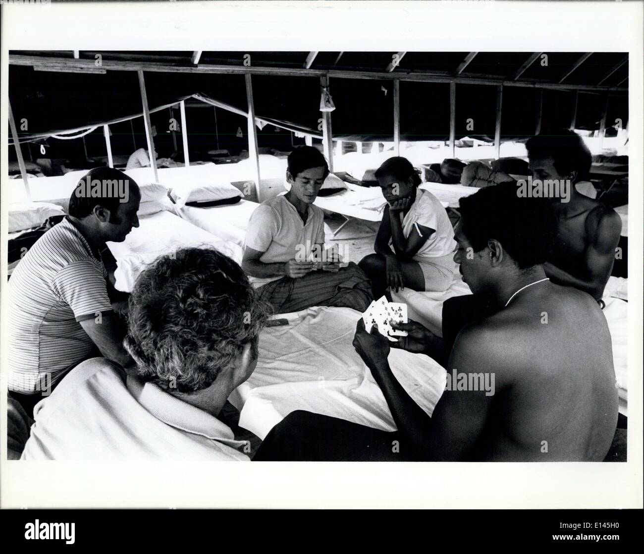 Apr. 04, 2012 - Cuban refugees pass the time in the tent city in Ft. Walton Beach by playing cards.  Pi Stock Photo