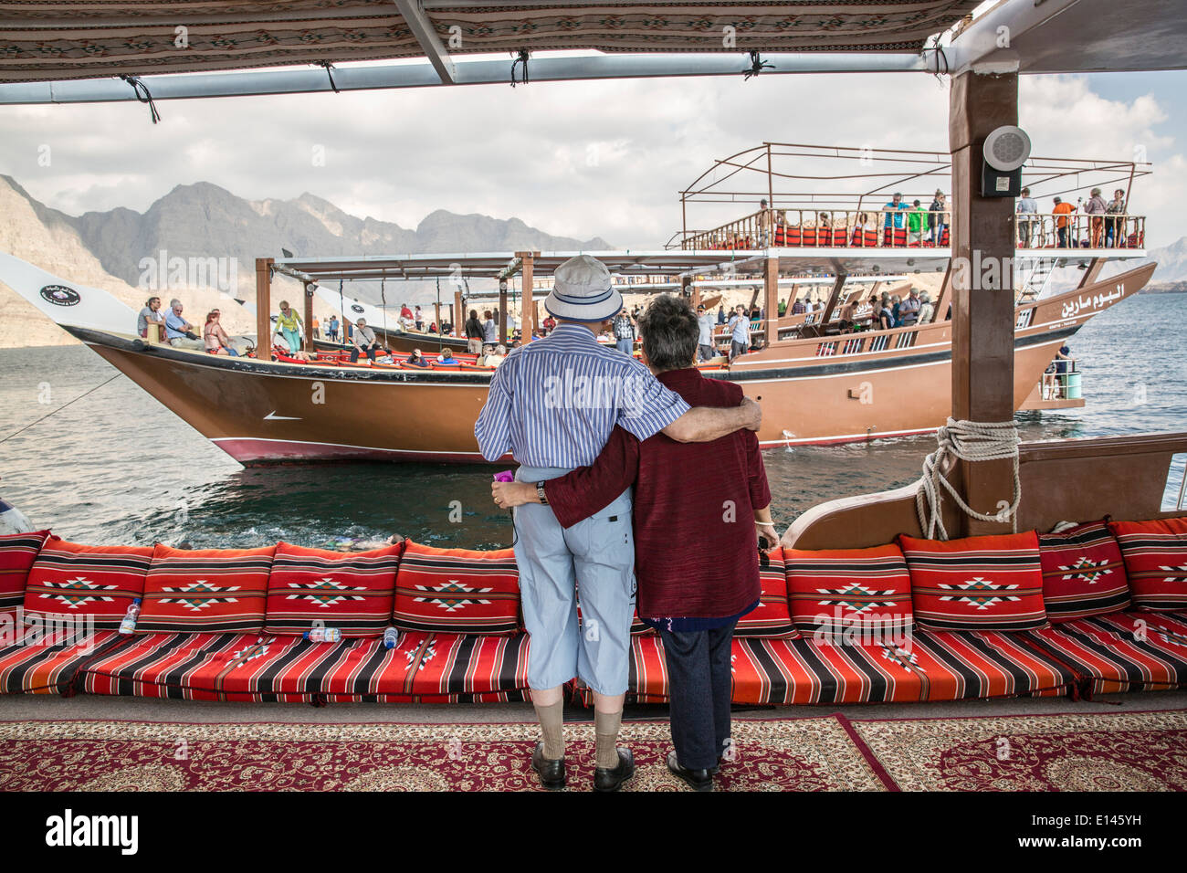 Oman, Khasab, Tourists on bow Stock Photo