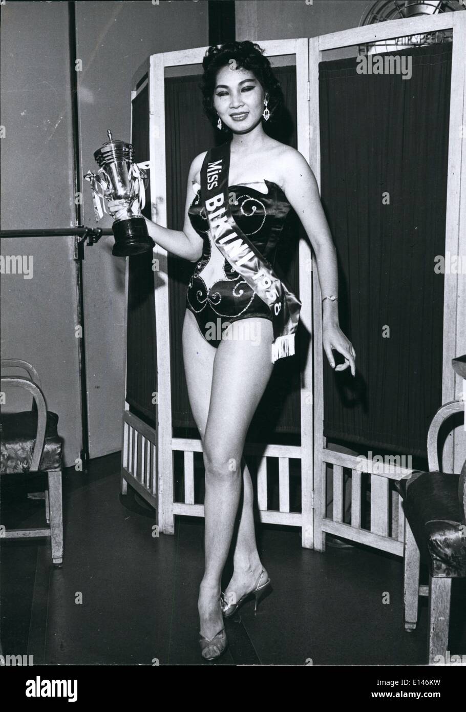 Apr. 16, 2012 - Singapore's Miss Bikini 1959: Miss Daisy Szeto age 22, was the winner of the Miss Bikini Contest held in Singapore. She will reign during 1959. Her vital statistics are 36-23-35, and she was born in Canton, China. Her bathing suit has a built in air vent in the front covered by a net 'window' giving a view of her tummy. Stock Photo