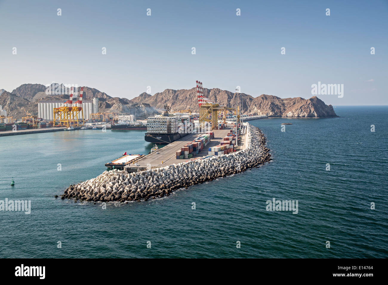Oman, Muscat, Harbor Mina As Sultan Qaboos. Container ship Stock Photo