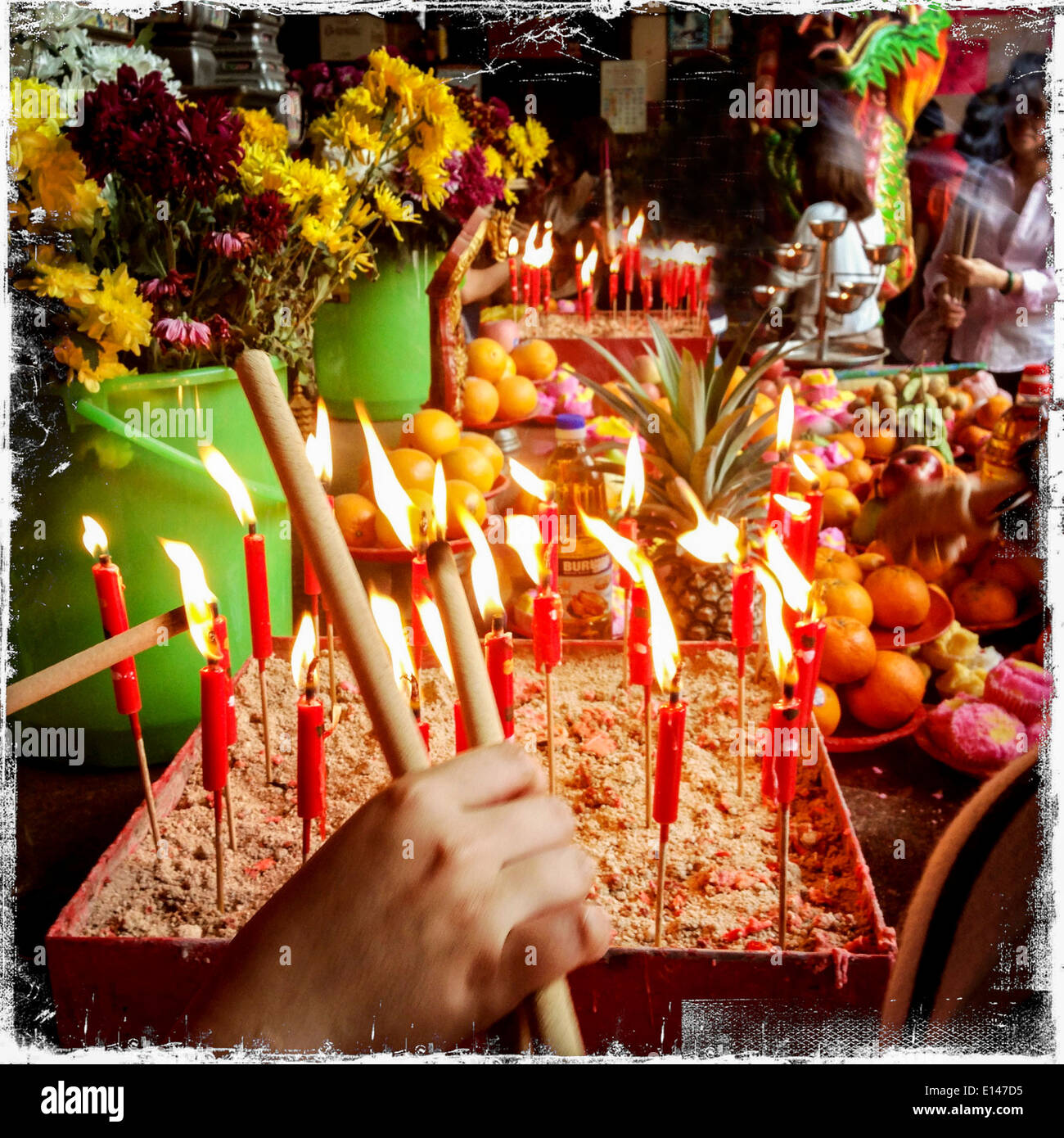 Candles burning for Chinese New Year in Hindu temple - Smartphone Captured Stock Image