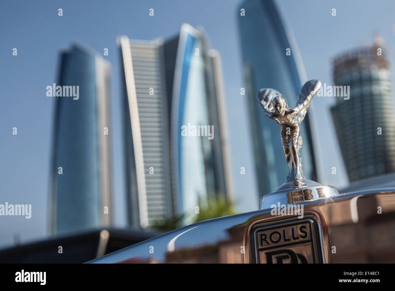 United Arab Emirates,  Abu Dhabi, Rolls Royce car. background Etihad Towers Stock Photo