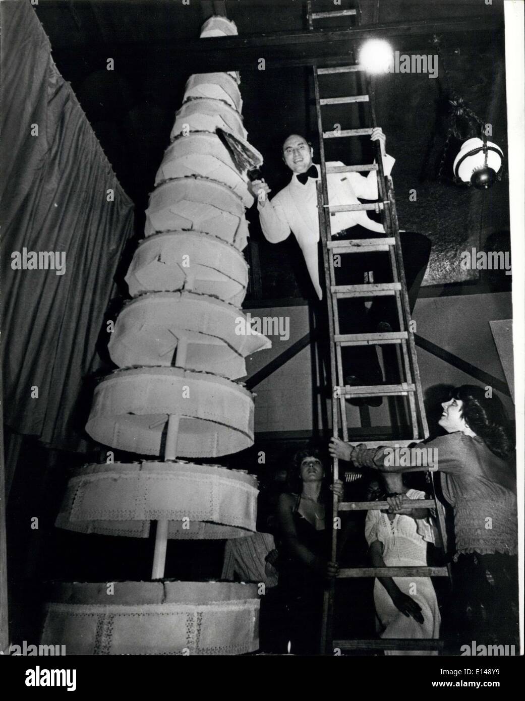 Apr. 17, 2012 - The Highest Fancy Cake In The World: This gigantic teared cake, prepared for the 5th birthday of the largest hotel in Zurich, Switzerland is exactly five meters high. This could be the highest ever constructed as they're is no mention in the Guinea Book of Records of any higher. Photo shows Rene Hatt ''father'' of the Nova-Park Hotel chain, gives last touch to this masterpiece. Stock Photo