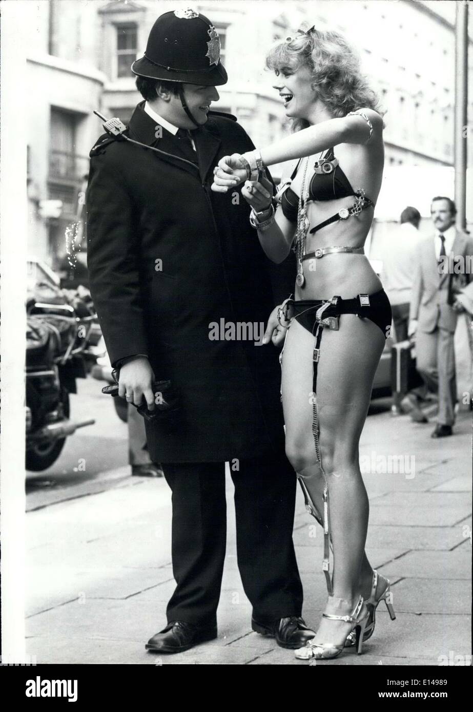 Apr. 17, 2012 - Watch! It Policeman: The usual saying in Britain is, If you want to know the time ask a policeman, but model Sara, reversed it by showing the friendly policeman the million pounds worth of watches that she was wearing on her comely figure in London today. Stock Photo