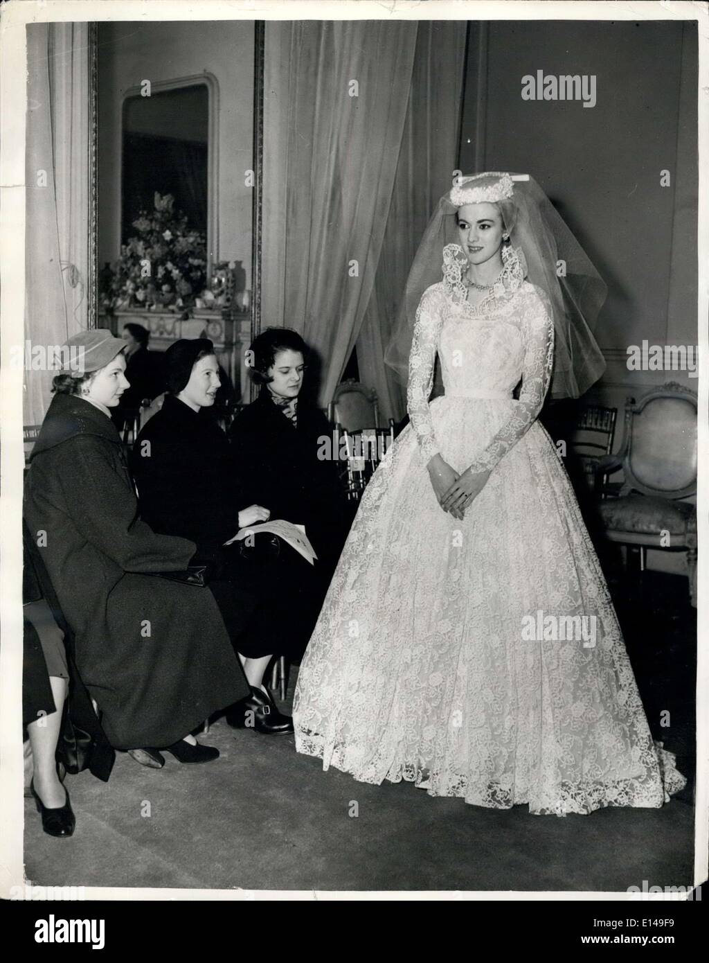 Apr. 17, 2012 - She show her own wedding gown at Fashion display. Postpones marriages for show: London Model - Twenty year old Sheila Morgan has postponed her late January wedding to business man Paul Symonds to a date in March so that she can model gowns in the showing of the Spring Collection of her boss Mr. Ronald Paterson newest member of the Incorporated Society of Fashion Designers. The main style that she is displaying at the show is hew own wedding gown designed and presented to her by Mr. Paterson Stock Photo