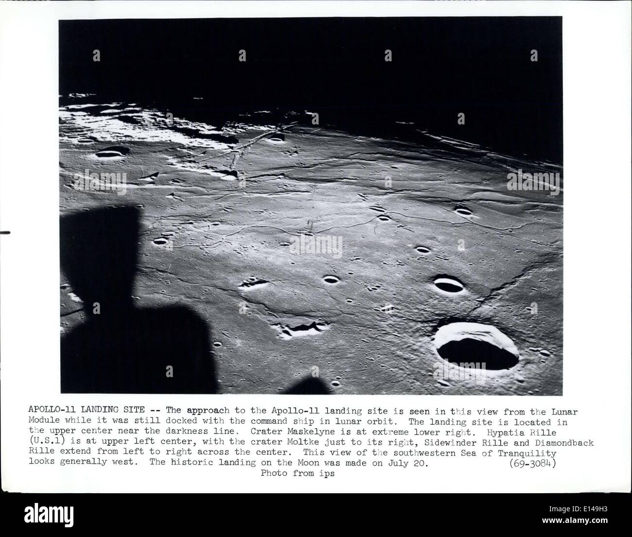 Apr. 17, 2012 - Apollo Landing Site: The approach to the Apollo 11 landing site in seen in this view from the Lunar Module while it was still docked with the command ship in lunar orbit. The landing site is located in the upper center near the darkness line. Crater Maskelyne us at extreme lower right. Hypatia Rille (U.S.1) is at upper left center, with the carter Moltke just to its right, Sidewinder Rille and Diamondnack Rille extend from left to right across the center. This view of the Southwestern Sea of Tranquility looks generally west. The historic landing on the Moon was made on July 20 Stock Photo