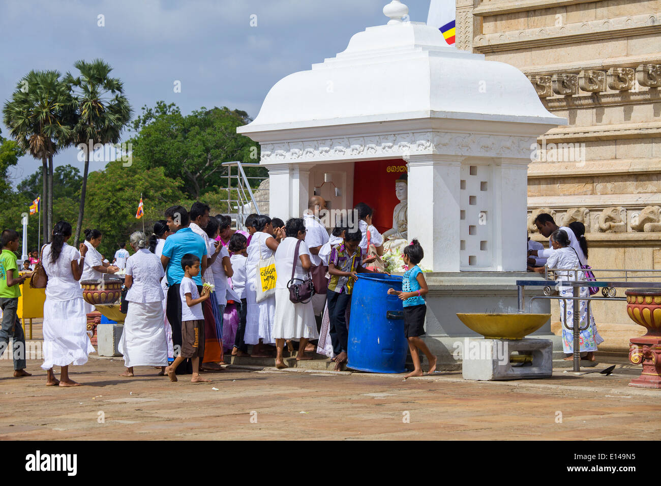 Pilgrims praying on the main yard near the big temple at Anuradhapura, Sri Lanka Stock Photo