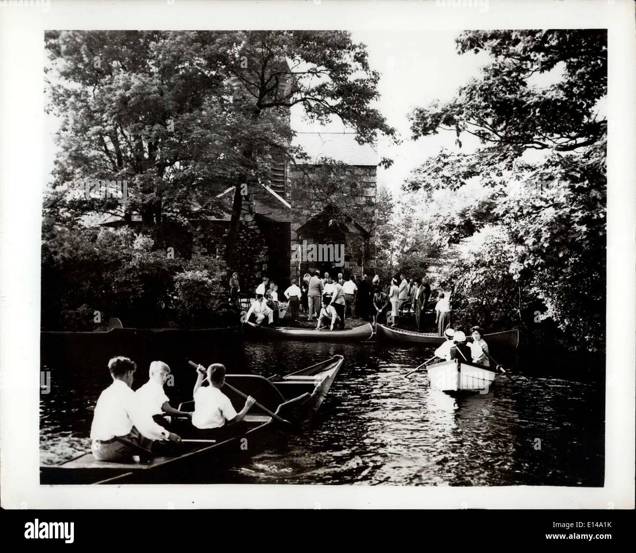 Apr. 17, 2012 - Row to Church services : Smoke Rise, N.J. Vacationers in this lake area Row to attend services at St. Hubert's chapel on Chapel island in nearby lake Kinnelon. The chapel was Built by Francis S. Kinney, who owned A 5,000 - acre Estate on which the island is located. Today more than 250 families have bought property in the development and many of them comprise the Membership of St. Hubert's Chapel. Stock Photo