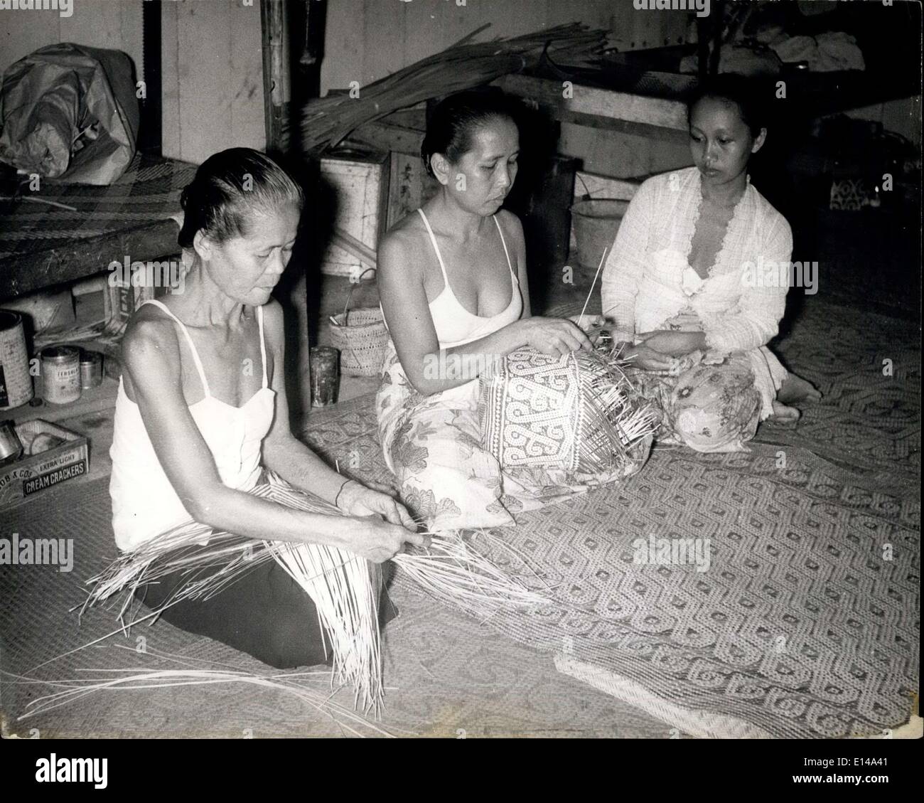 Apr. 17, 2012 - Native women make colorful baskets. Sarawak leper women in the settlement work as weavers. They make colorful baskets which the settlement markets for them. Winning a war against leprosy: The scourge is a scourge no longer wonder drugs guarantee cures for Sarawak's native population: New drugs being used at the Sir Charles Brooke memorial settlement, 13 miles from Kuching, are taking away all terror of the disease which once meant social banishment for the afflicted. In the past 10 years, a transformation in diagnosis and treatment (Illegible) place Stock Photo