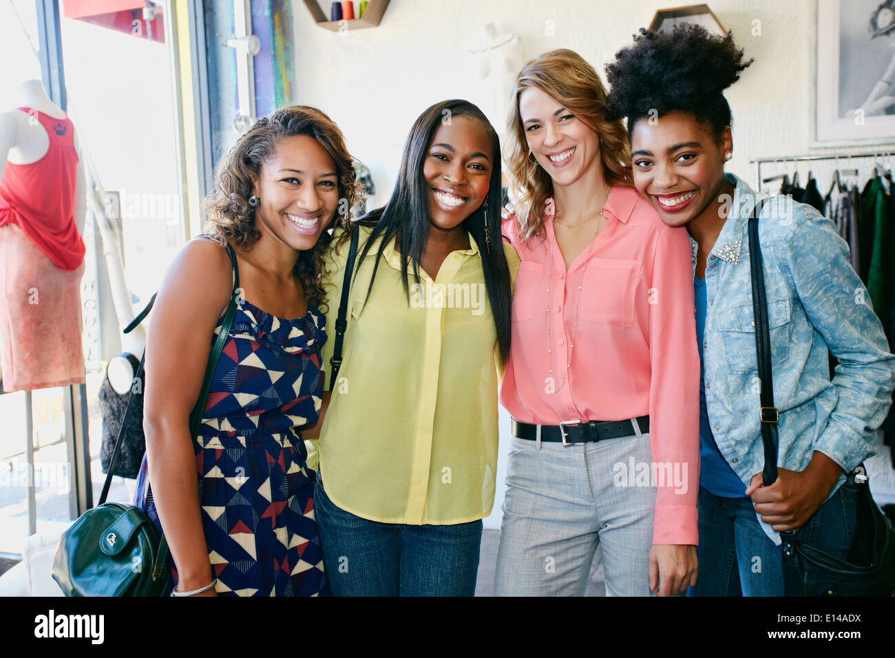 Three women together shopping hires stock