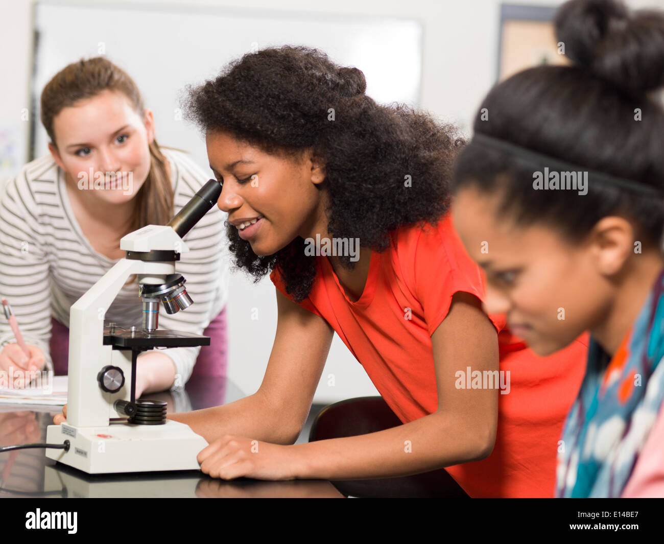 Students working together in chemistry lab Stock Photo