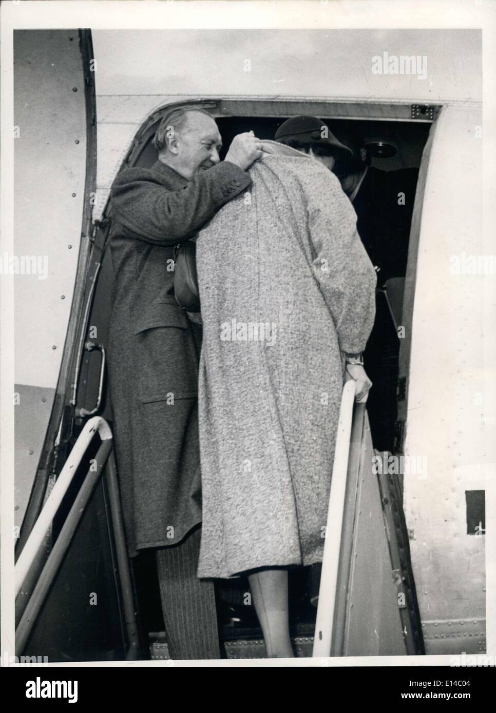 Apr. 17, 2012 - Federal Chancellor Dr. Konrad Adenauer: seized his daughter Lotte by the collar when they were about to begin their trip to America on the Cologne- Bonn Airfield Wahn. Lotte was afraid of the photographers. Stock Photo
