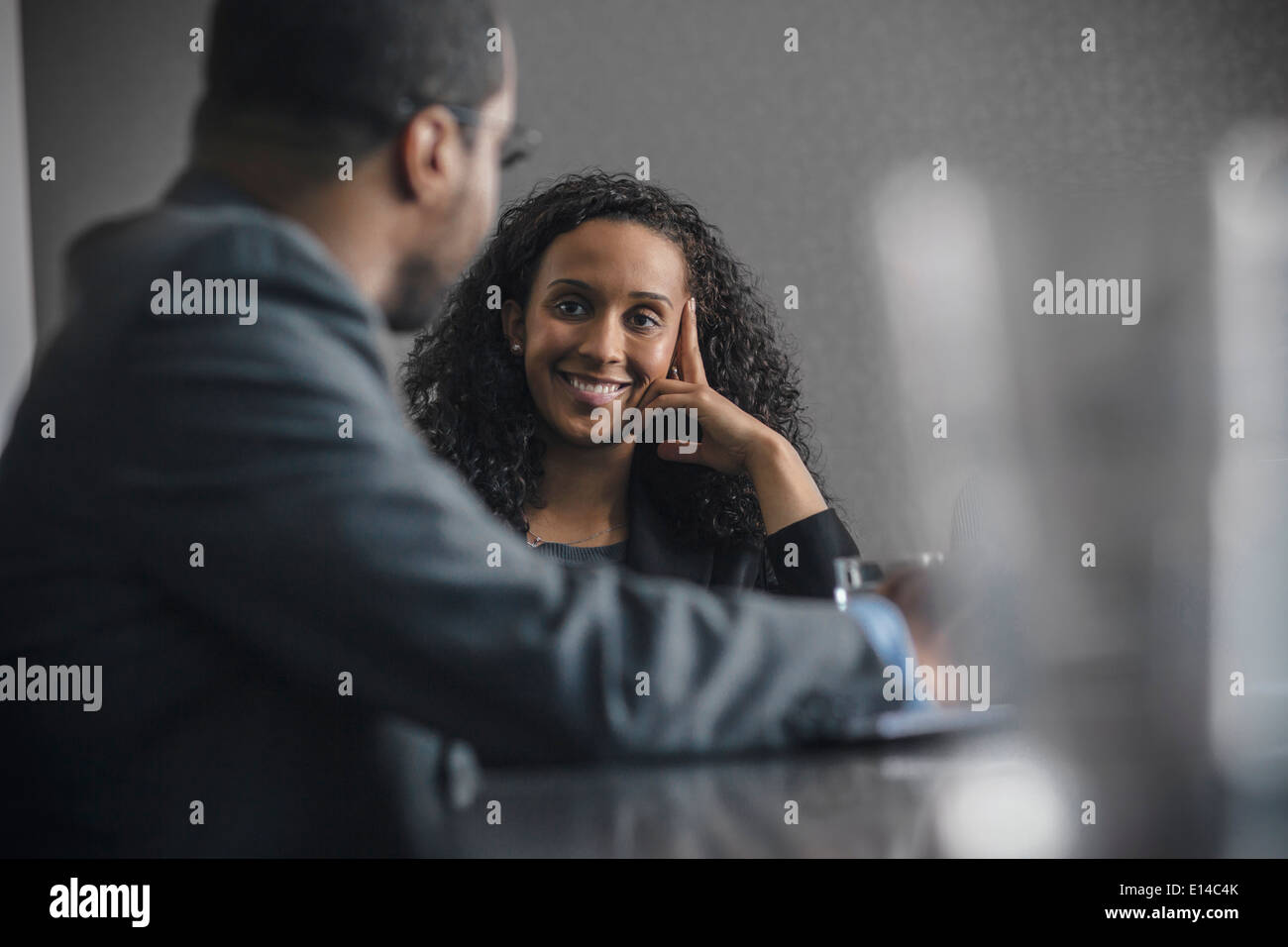 Mixed race business people talking in meeting Stock Photo - Alamy