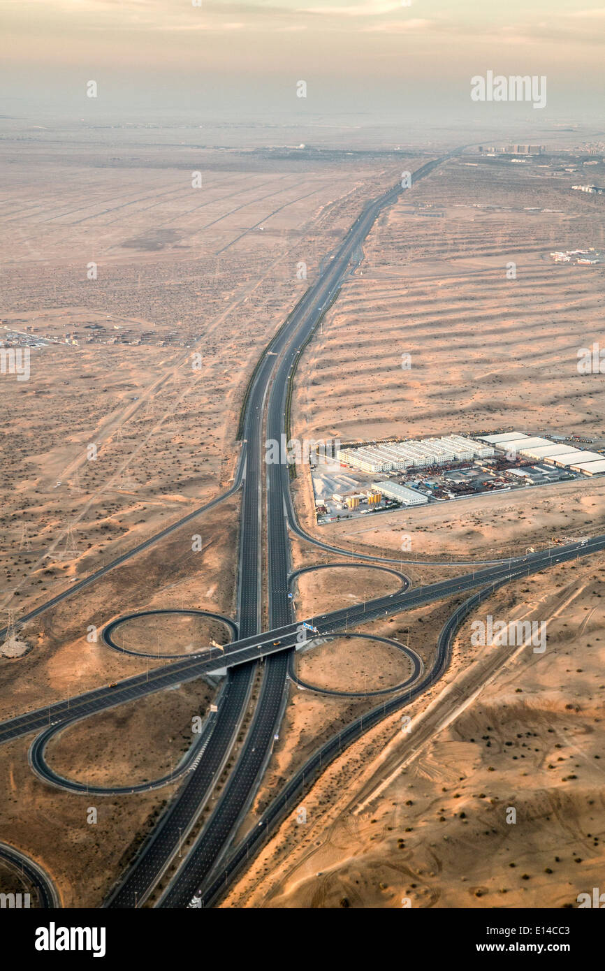 United Arab Emirates, Dubai, Highway in desert. Aerial Stock Photo
