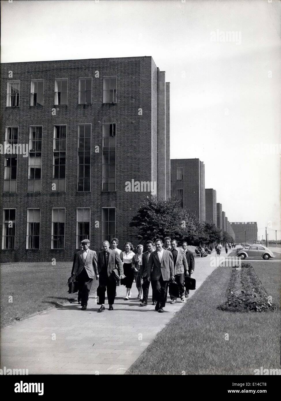 Apr. 17, 2012 - Along the front of the office buildings some of the workers start on their way home after finishing the early morning shift. 5.30 - 13.30. Stock Photo