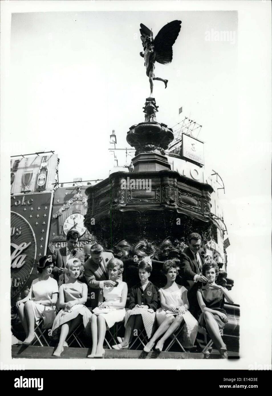 Apr. 17, 2012 - ''A Hairset At The Eros Fountain''.. Six models to be seen alongside the Eros Fountain, Piccadilly - this morning with fantasy hair styles - having their hair set with water from the fountain. The styles were created by Mr. L. Pountney Interntionale, of Hounslow, Middlesex. Photo shows Eros looks down as the models have their hair set from the fountain this morning. They are L-R Denise Johns; June Hunt; Shirley Gifford; Mary Sargent; Ricky Betis and Bettina West. Stock Photo